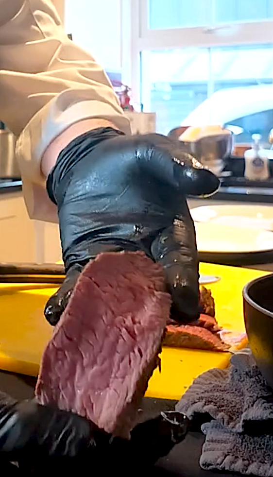 Close-up of a tender pink slice of sous vide beef fillet, carved by private chef Giuseppe Manzoli at Loch Tay.