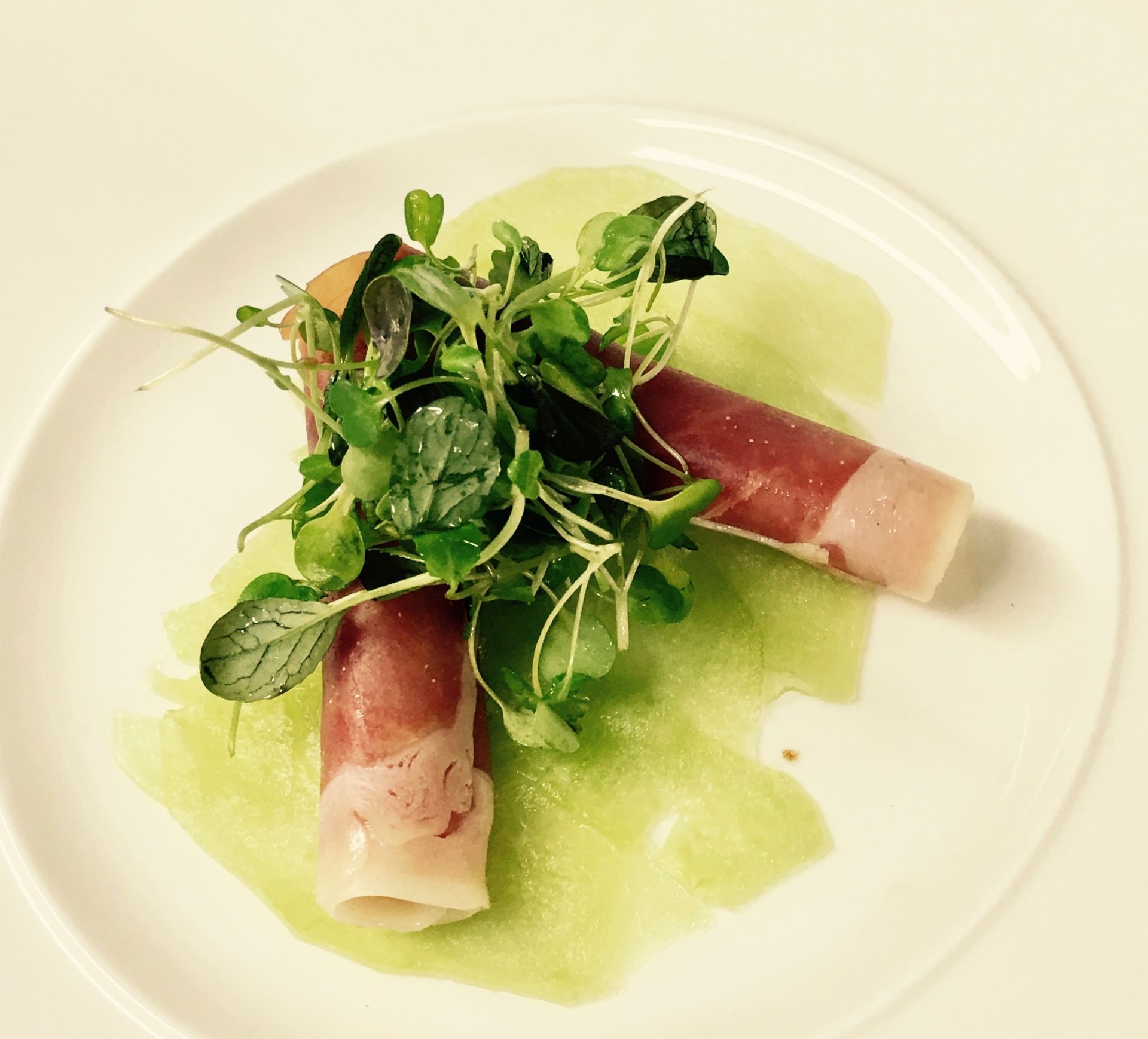 Elegantly plated prosciutto and microgreens starter for a private wedding dinner in Scotland