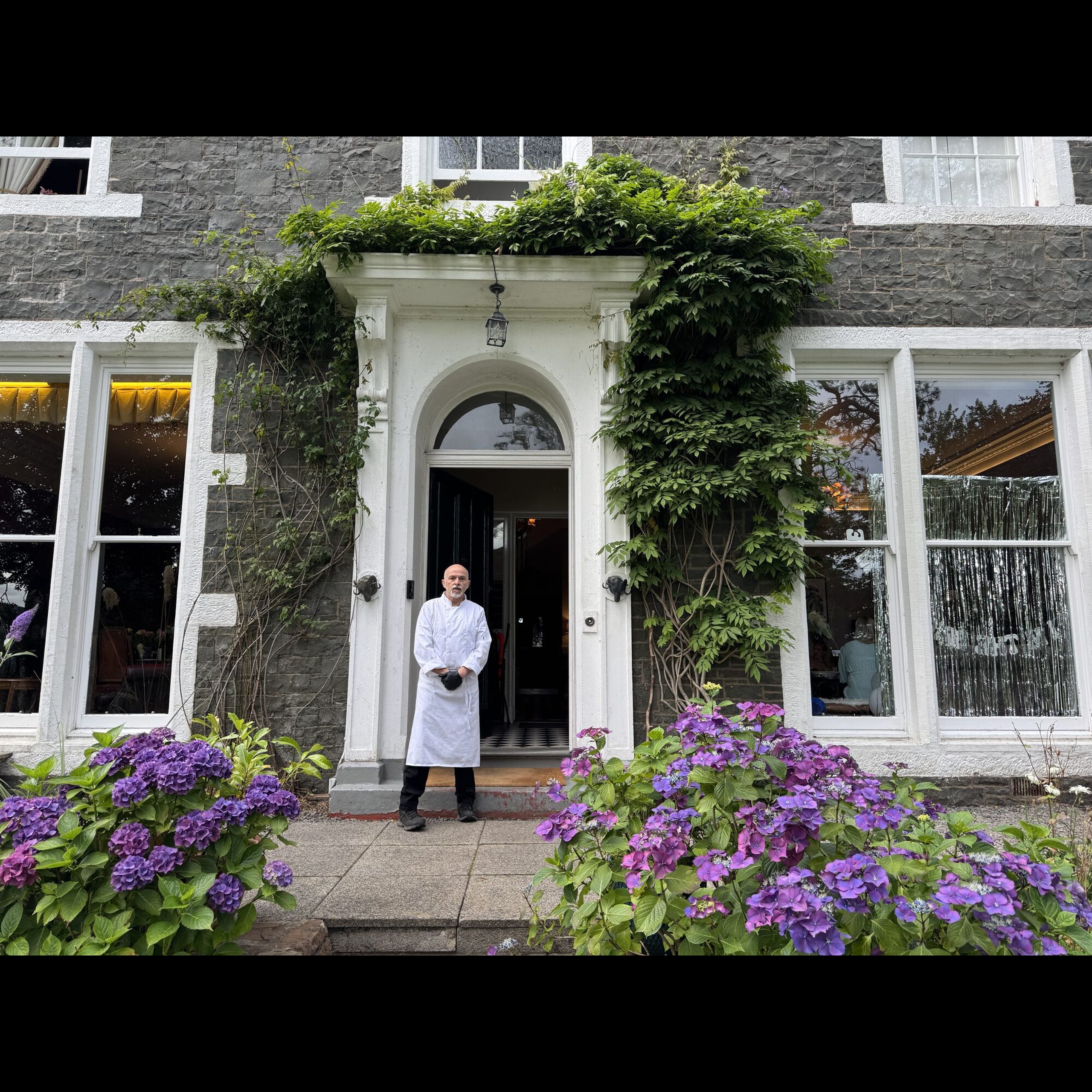 Private chef Giuseppe Manzoli at the front door of Beechwood House, Moffat