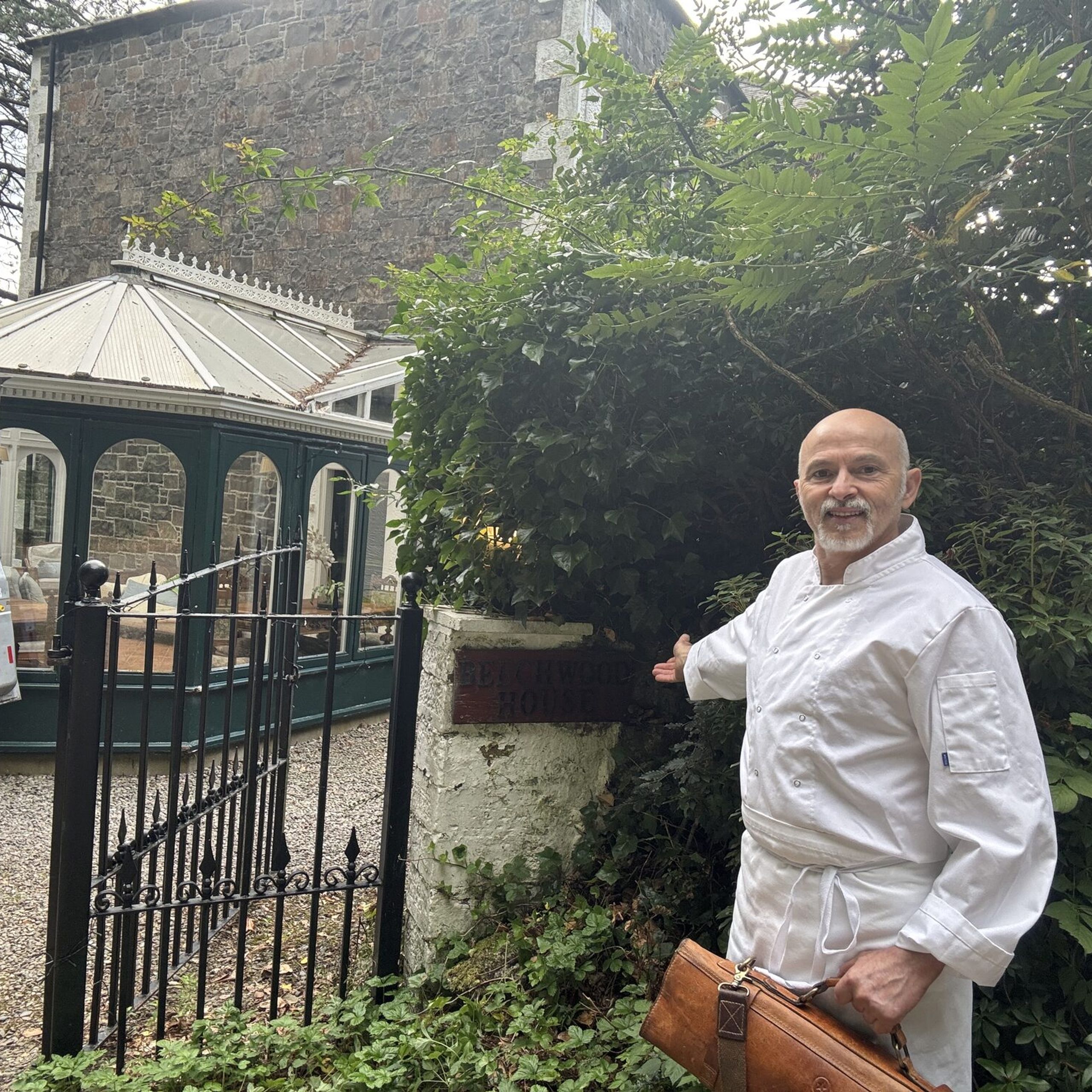 Giuseppe Manzoli arriving at the Beechwood House sign in Moffat with his knife bag