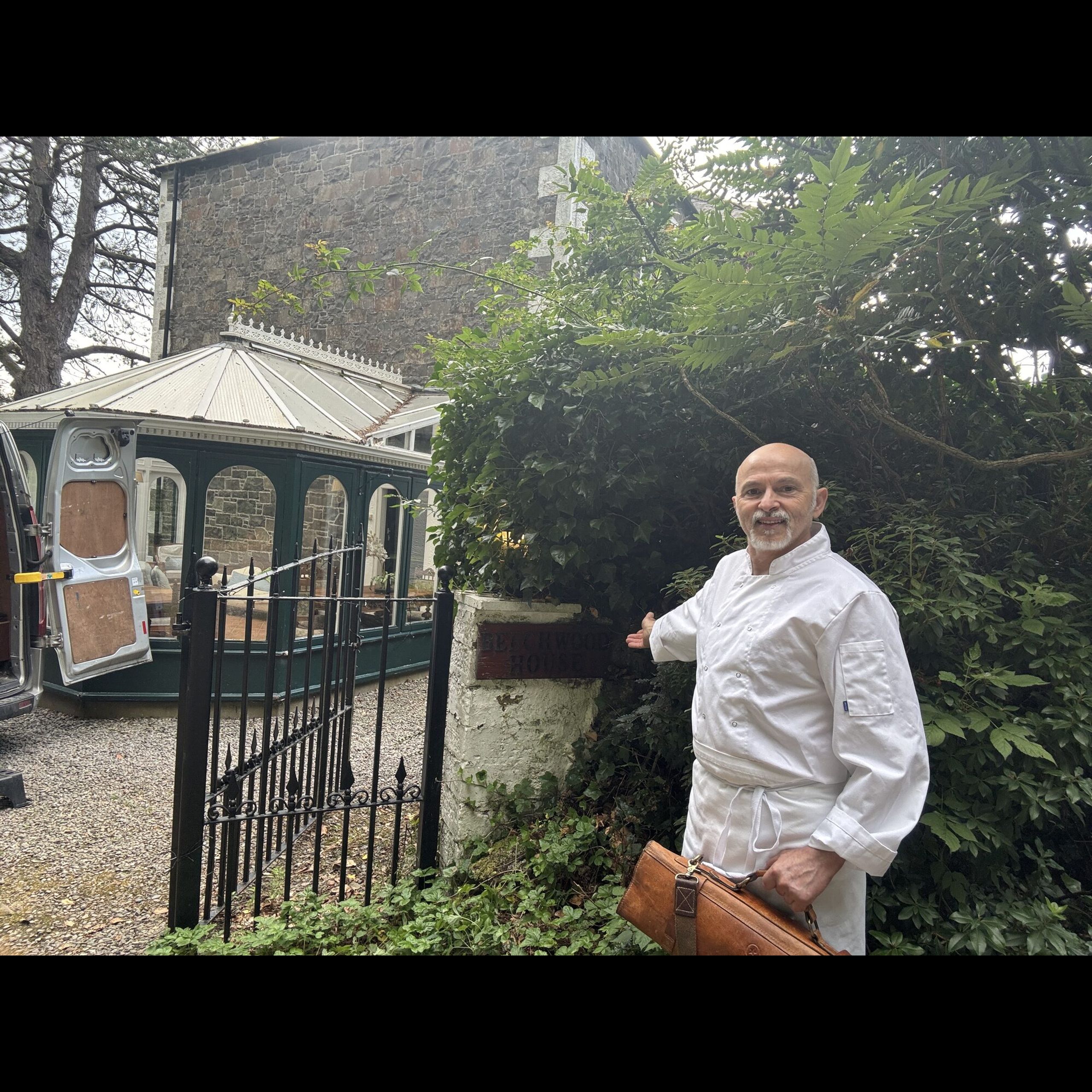 Giuseppe Manzoli arriving at the Beechwood House sign in Moffat with his knife bag