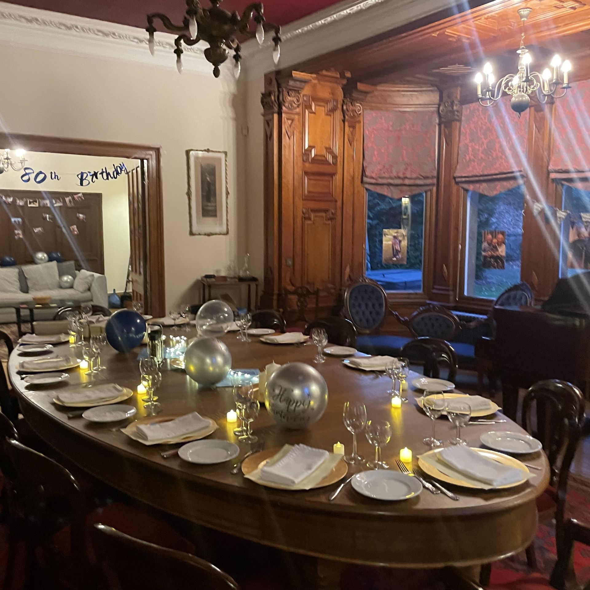 Dining table set for a private 80th birthday dinner at Moffat Mansion — Victorian dining room with chandeliers and place settings, prepared by private chef Giuseppe Manzoli