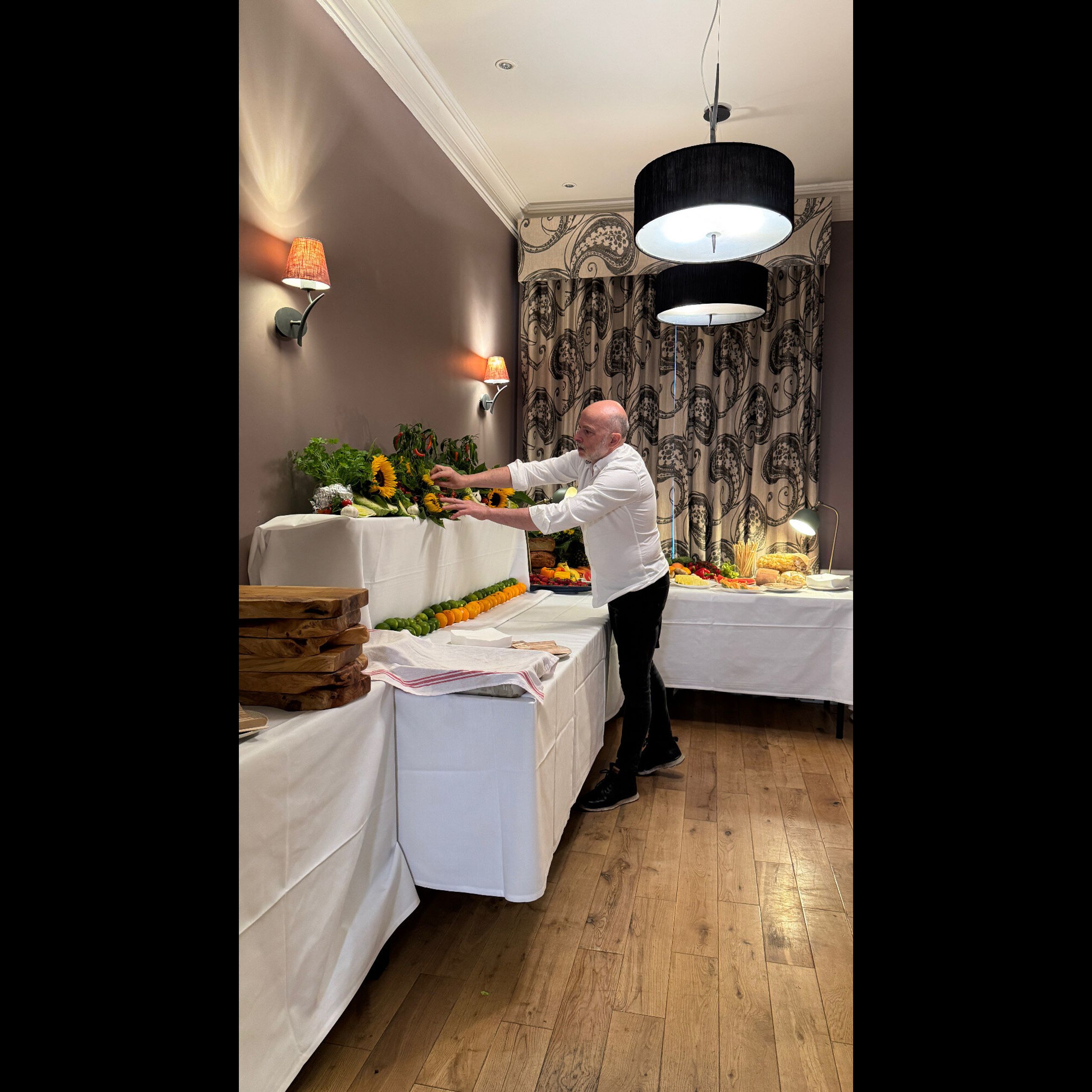Giuseppe Manzoli preparing a graduation party buffet for 40 guests in St Andrews