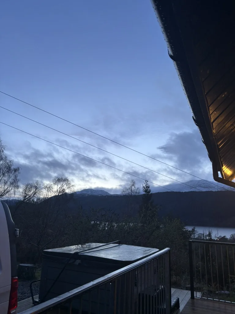 Evening view across Loch Ness and the Highland hills from Craggiemhor Lodge