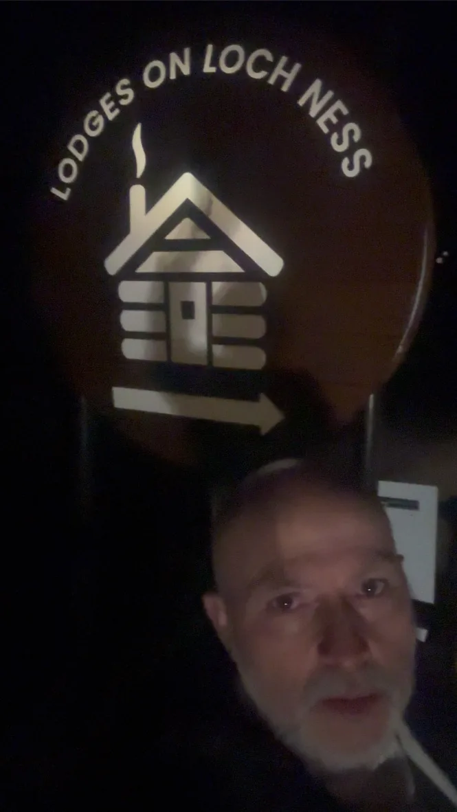 Giuseppe Manzoli beside the Lodges on Loch Ness sign after a private dinner