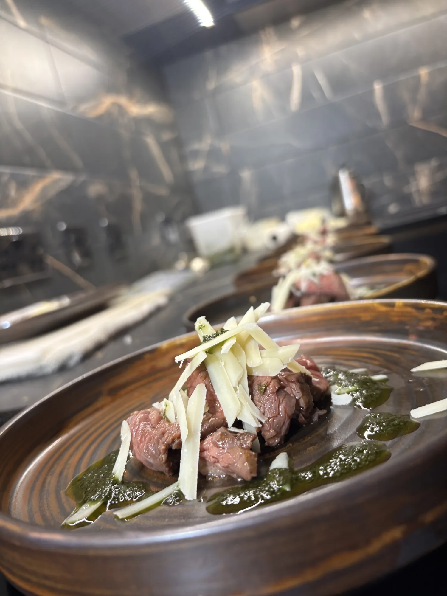 Tagliata di Manzo with Parmesan and herb dressing prepared for a pre-wedding dinner at Loch Ness